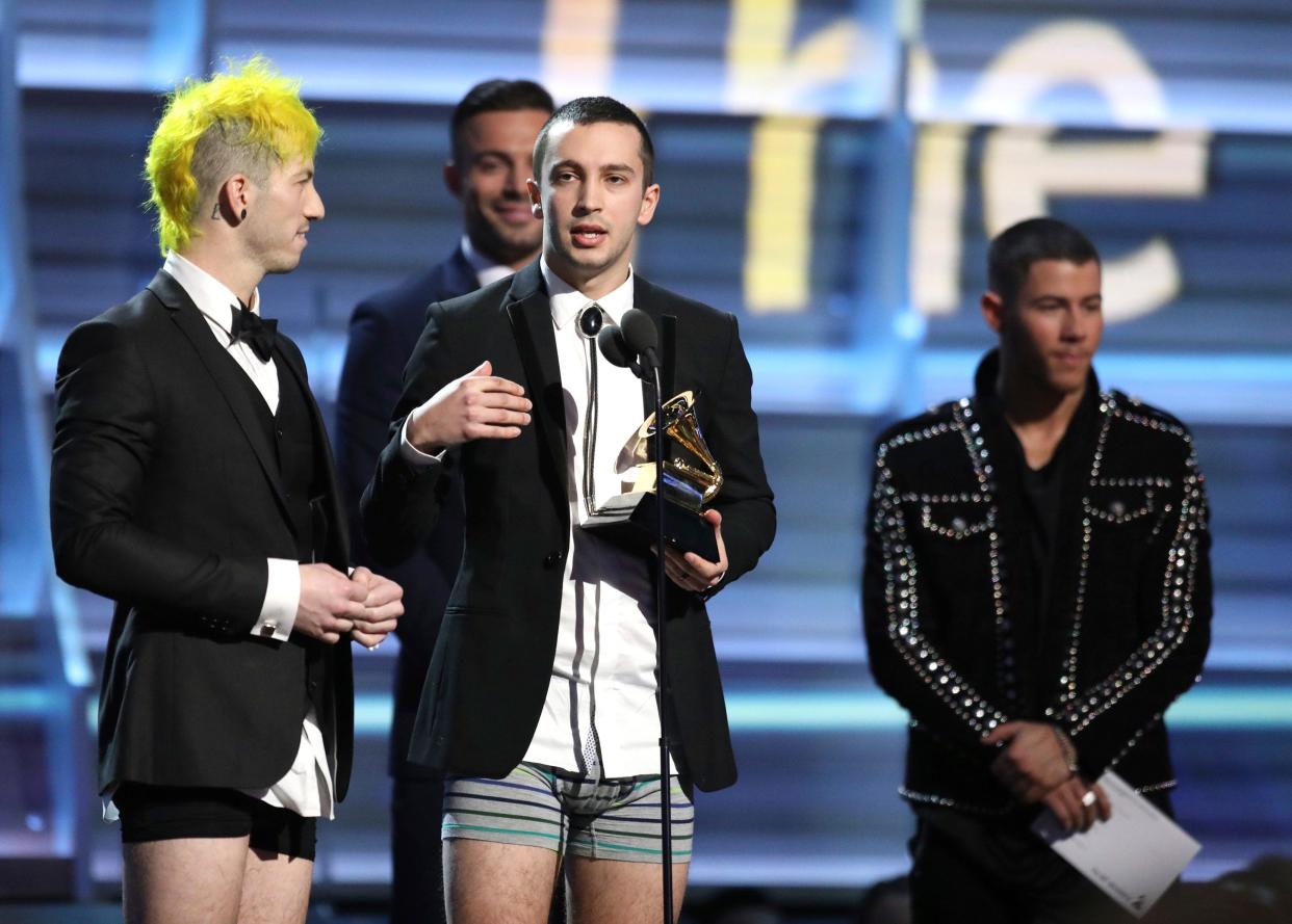 Josh Dun, left, and Tyler Joseph of Twenty One Pilots, both originally from Columbus, appear onstage without pants to accept the award for best pop duo/group performance for "Stressed Out" at the 59th annual Grammy Awards in 2017.