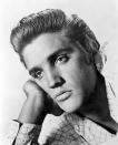 <p>While Presley’s hairstyles changed fairly dramatically throughout his life, he stayed good friends with his comb and wax (apparently he used three different varieties to tame his mane.) [Photo: PA] </p>