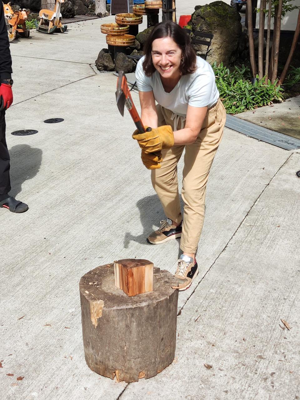 Writer Teresa Machan splitting wood like a pro