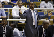 Florida International head basketball coach Isiah Thomas, center, yells from the bench during an exhibition game against Northwood, as associate head coach Anthony Anderson, left, and assistant coach William Eddie, right, look on in Miami, Wednesday, Nov. 4, 2009. Thomas needs to make a winner of little-known Florida International and revive his own career in the process. (AP Photo/Lynne Sladky)