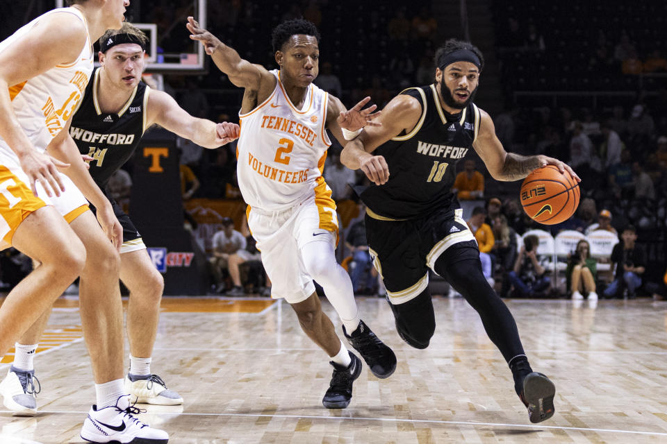 Wofford guard Corey Tripp (10) drives against Tennessee guard Jordan Gainey (2) during the second half of an NCAA college basketball game Tuesday, Nov. 14, 2023, in Knoxville, Tenn. (AP Photo/Wade Payne)