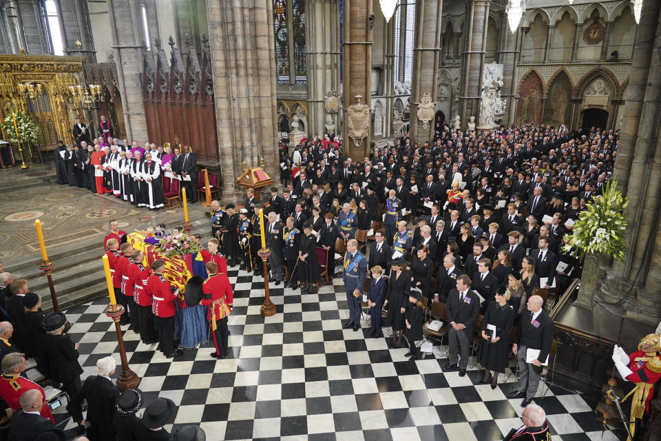 The coffin of Queen Elizabeth II is carried into Westminster Abbey for the funeral service, in central London, Monday Sept. 19, 2022. The Queen, who died aged 96 on Sept. 8, will be buried at Windsor alongside her late husband, Prince Philip, who died last year. (Dominic Lipinski/Pool via AP)