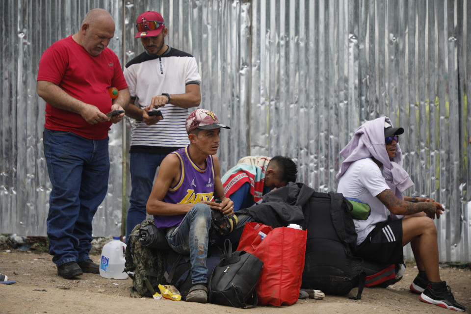 Migrants mostly from Venezuela and Cuba, wait for a Honduras Migration transit permit to continue their way north to Guatemala, and hopefully to the Mexico-United States border, in Danlí, Honduras, Wednesday, Oct. 11, 2023. (AP Photo/Elmer Martinez)
