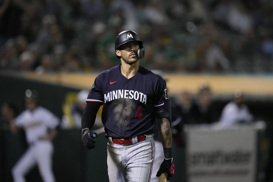 Minnesota Twins' Carlos Correa walks to the dugout after being called out on strikes during the sixth inning o the team's baseball game against the Oakland Athletics on Friday, July 14, 2023, in Oakland, Calif. (AP Photo/Godofredo A. Vásquez)