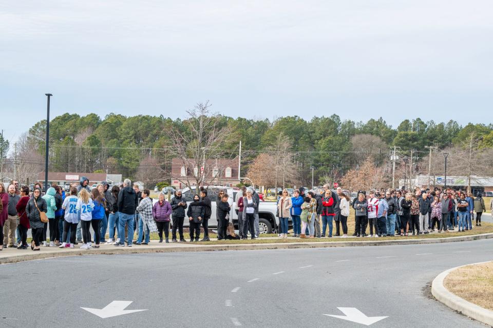 Family and friends of Jamin Pugh stand in long lines awaiting the doors to open at the Laurel High School where the services will be held in the gym. Jamin Pugh, a local pro wrestler was killed in an automobile accident on Jan. 17, 2023.