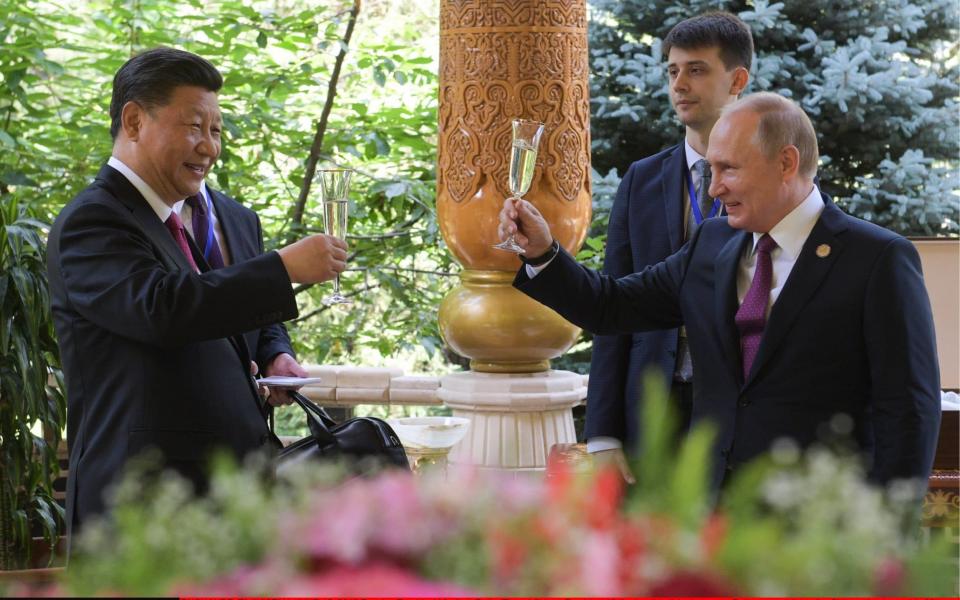 Xi is using Taiwan to distract from struggles at home - just like Putin did with Crimea - Alexei Druzhinin/TASS