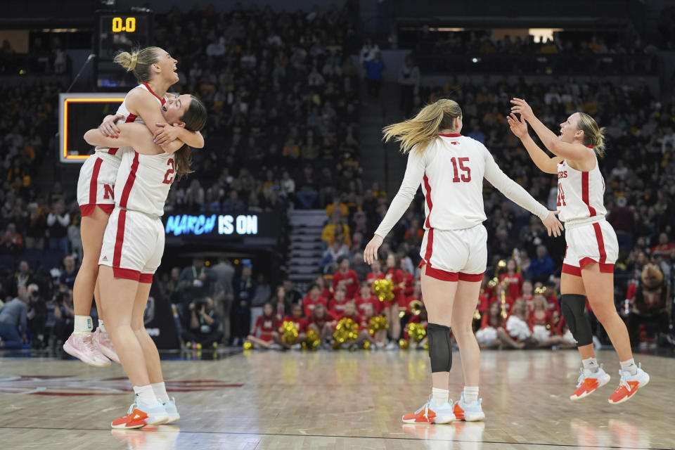 Nebraska players celebrate as time expires during team's win over Maryland of an NCAA college basketball semifinal game at the Big Ten women's tournament Saturday, March 9, 2024, in Minneapolis. (AP Photo/Abbie Parr)