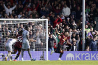 Bournemouth's Dominic Solanke, right, celebrates scoring the opening goal during the English Premier League soccer match between AFC Bournemouth vs Everton at the Vitality Stadium, Bournemouth, England, Saturday, March 30, 2024. (Andrew Matthews/PA via AP)