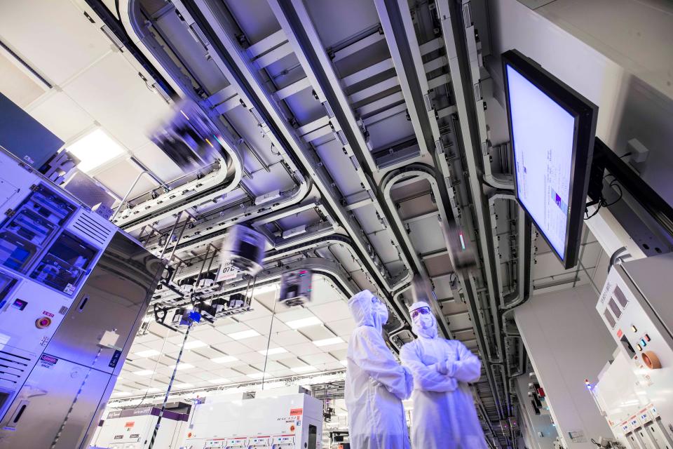 Lab technicians in GlobalFoundries clean room lab in Malta, New York. GM and GF announced a long-term agreement on Feb. 9, 2023, to help GM secure production of semiconductor chips.