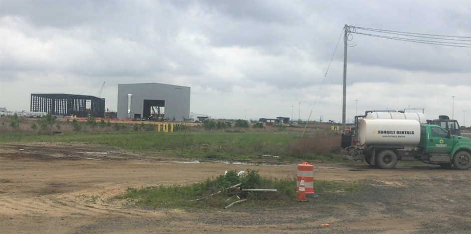 These two buildings under construction at the Paulsboro Marine Terminal will engage in fabricating 400-foot-tall steel monopiles for use in a planned offshore wind turbine network. May 6, 2022.