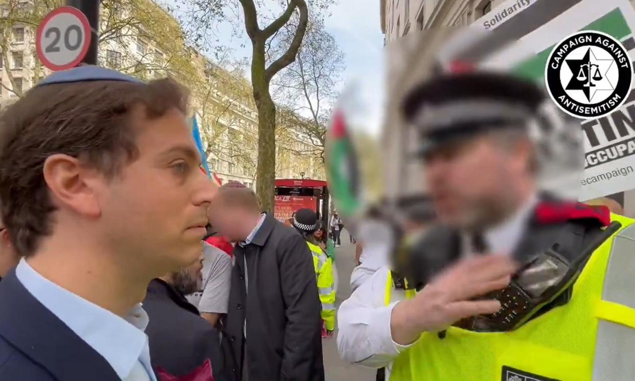 <span>Gideon Falter speaking to a Met police officer during a pro-Palestinian march in London last weekend.</span><span>Photograph: Campaign Against Antisemitism/PA</span>