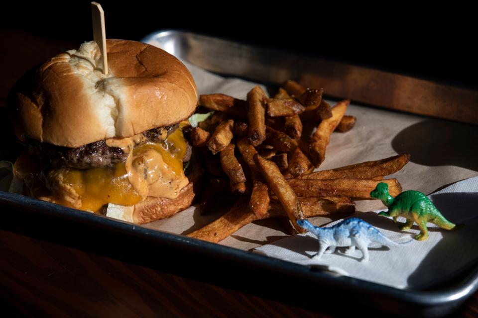 The Double Rex with cheddar, colossal sauce and small fry from Rex Prehistoric Patties at Fork Forty Food Hall in Salem, Ore. on Wednesday, Nov. 17, 2021.