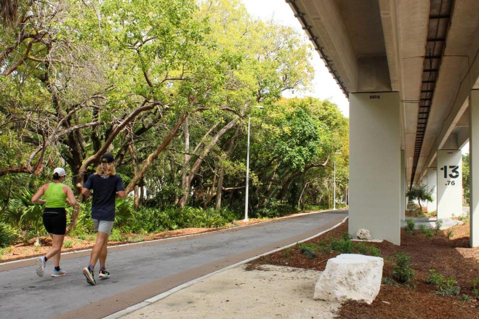 Joggers run on the Hammock Trail section in Brickell of a new, two-mile section of The Underline that opens on April 24, 2024. Friends of the Underline