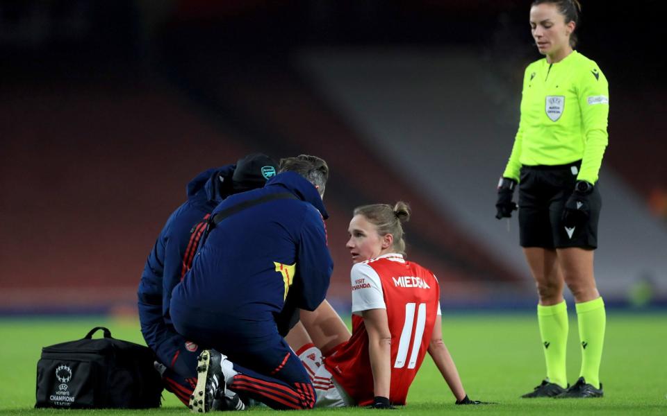 Arsenalâ€™s Vivianne Miedema receives medical attention during the UEFA Women's Champions League Group C match at the Emirates Stadium - Manchester United set to reject Arsenal's world-record Alessa Russo bid - Bradley Collyer/PA