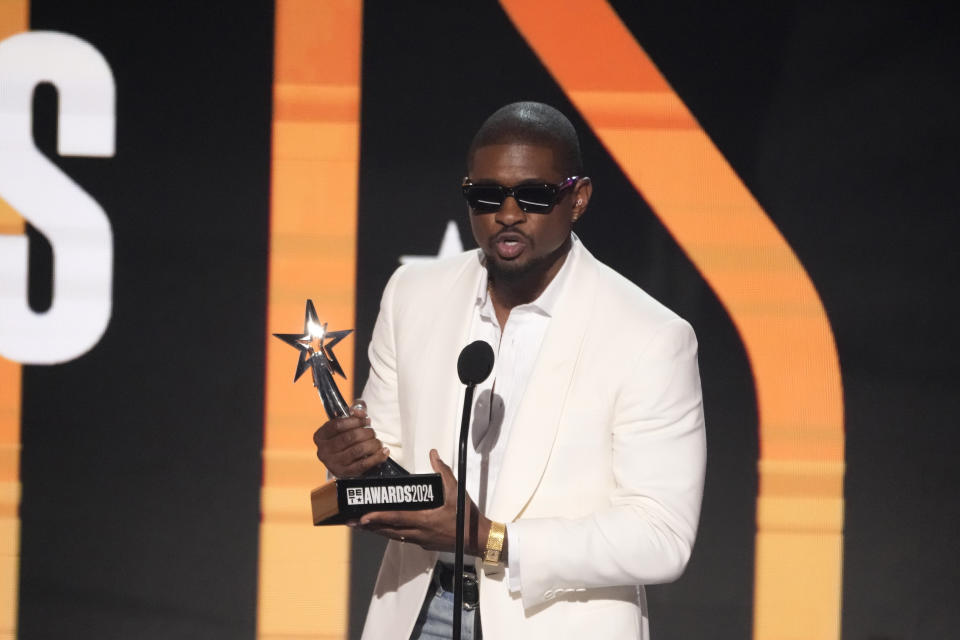 Usher accepts the award for best male R&B/pop artist during the BET Awards on Sunday, June 30, 2024, at the Peacock Theater in Los Angeles. (AP Photo/Chris Pizzello)