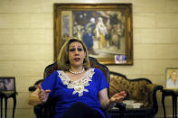 Leila Saleh, wife of Lebanese citizen Mohammed Saleh, who was detained in Greece last week, speaks during an interview at their home in a suburb of the southern port city of Sidon, Lebanon, Tuesday, Sept. 24, 2019. Saleh was detained on suspicion of involvement in the 1985 TWA hijacking and set free after it turned out to be a case of mistaken identity. Saleh is in good health and expected to fly back to Lebanon, he and his wife said Tuesday. (AP Photo/Bilal Hussein)