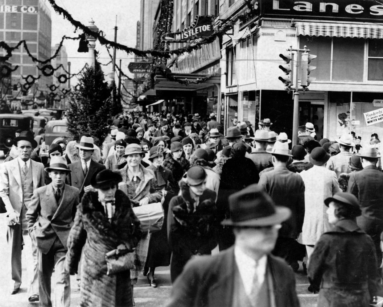 Downtown Oklahoma City merchants reported a 26% increase in Christmas season sales in 1934 compared to the previous year. This photo shows the crowd of shoppers packing sidewalks, bustling about.