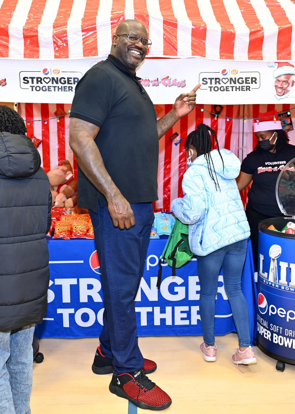 <p>Shaquille O'Neal surprises an Atlanta school with toys and treats as part of his Shaq-A-Claus and Pepsi Stronger Together event on Dec. 20 in McDonough, Georgia.</p>