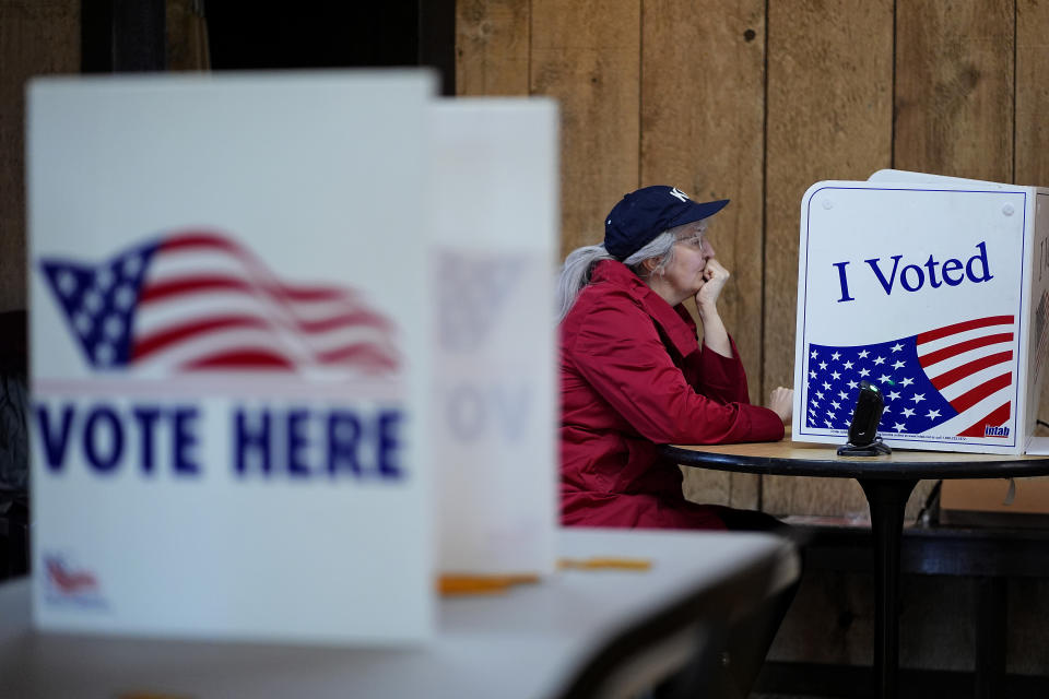 Katherine Castle votes Tuesday, April 2, 2024, at Yellow Rock Barn in Kansas City, Mo. Voters are being asked to decide whether to extend a sales tax to fund a new baseball stadium for the Kansas City Royals and football stadium improvements for the Kansas City Chiefs. (AP Photo/Charlie Riedel)