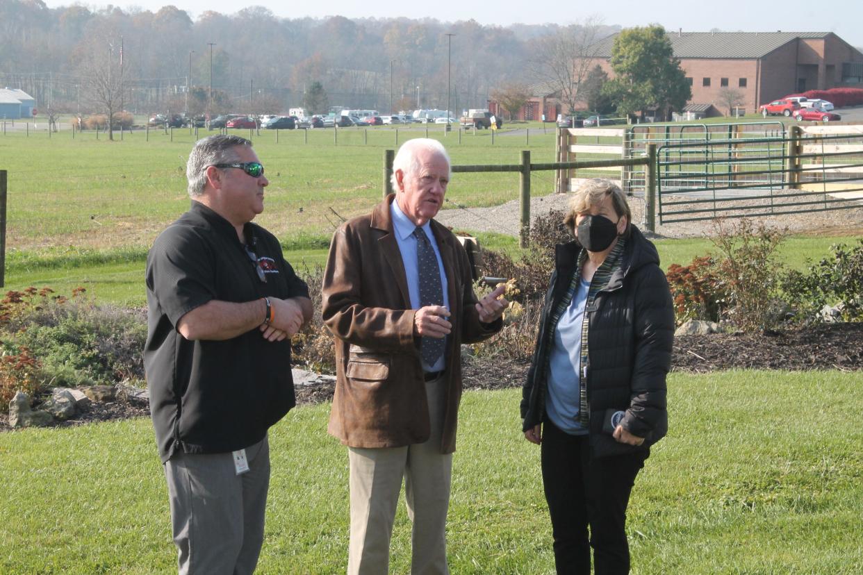 Casey Coffey, New Lexington school board President John McGaughey and American Federation of Teachers President Randi Weingarten discuss what activities the Future Farmers of America club offers students at the FFA barn across from the Perry County Fairgrounds. New Lexington Schools was recently awarded a $100,000 grant from AFT for its Workforce Development program.