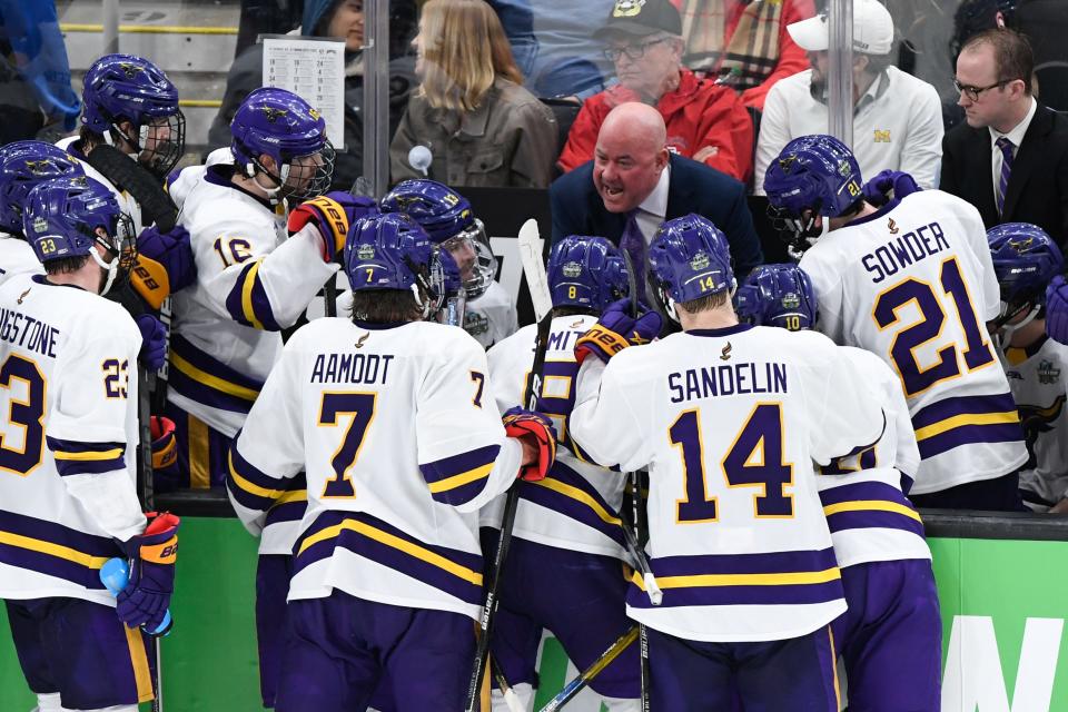 Apr 9, 2022; Boston, MA, USA; Minnesota State Mavericks head coach Mike Hastings talks with his team during a timeout in the third period of the 2022 Frozen Four college ice hockey national championship game against the Denver Pioneers at TD Garden. Mandatory Credit: Brian Fluharty-USA TODAY Sports