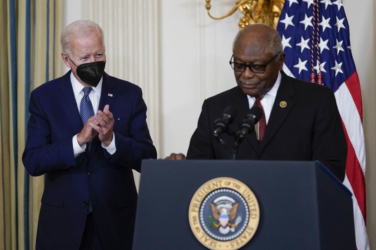President Biden listens as House Majority Whip Rep. James Clyburn (D-S.C.) speaks before Biden signs the Democrats' landmark climate change and health care bill in the State Dining Room of the White House in Washington, Tuesday, Aug. 16, 2022.