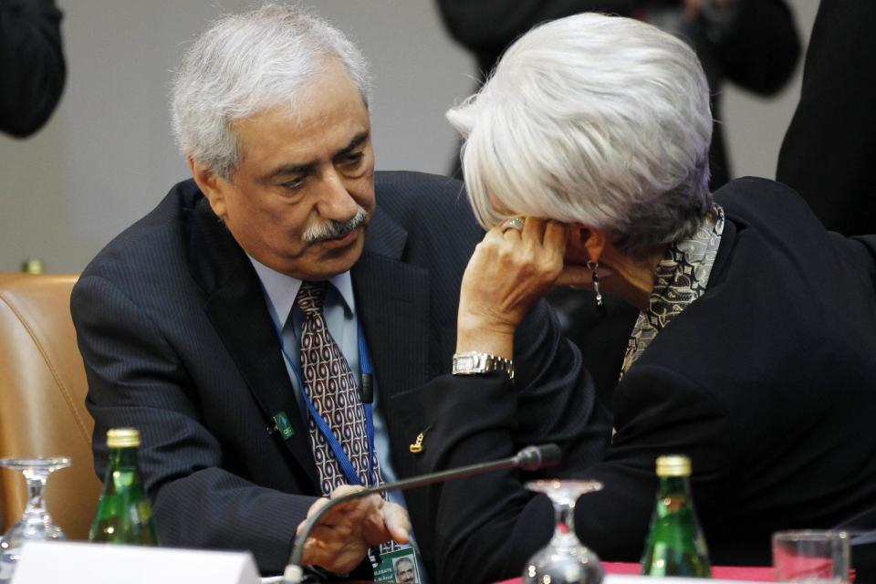 Fahad Al-Mubarak, governor of the Saudi Arabian Monetary Agency, left, talks with International Monetary Fund (IMF) Managing Director Christine Lagarde during a G-20 finance ministers and central bank governors meeting, Friday, April 20, 2012, at the IMF and World Bank Group Spring Meetings in Washington. (AP Photo/Charles Dharapak)