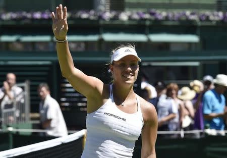 Angelique Kerber of Germany celebrates after winning her match against Carina Witthoeft of Germany at the Wimbledon Tennis Championships in London, June 30, 2015. REUTERS/Toby Melville