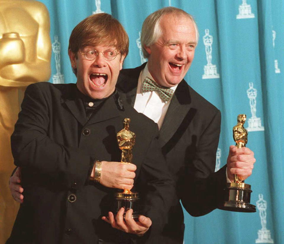 LOS ANGELES, CA - MARCH 28:  British singer and songwriter Elton John (L) poses with partner Tim Rice 27 March at the 67th annual Academy Awards in Los Angeles. John and Rice won Oscars for their original song "Can You Feel the Love Tonight?" from the film "The Lion King."       AFP PHOTO  (Photo credit should read DAN GROSHONG/AFP/Getty Images)