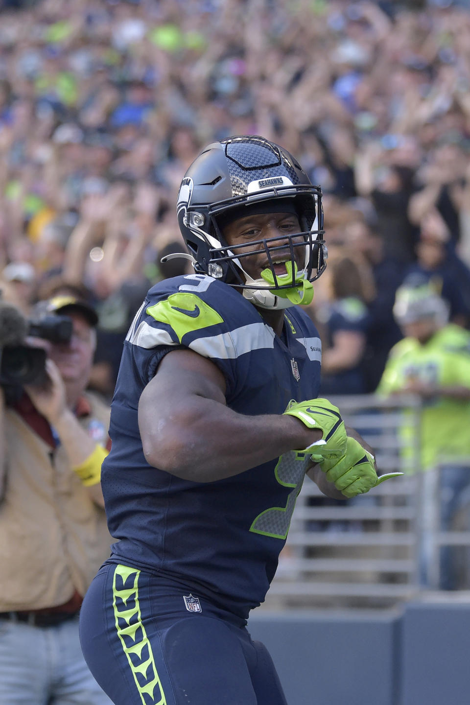 Seattle Seahawks running back Kenneth Walker III celebrates after scoring a touchdown against the Arizona Cardinals during the second half of an NFL football game in Seattle, Sunday, Oct. 16, 2022. (AP Photo/Caean Couto)