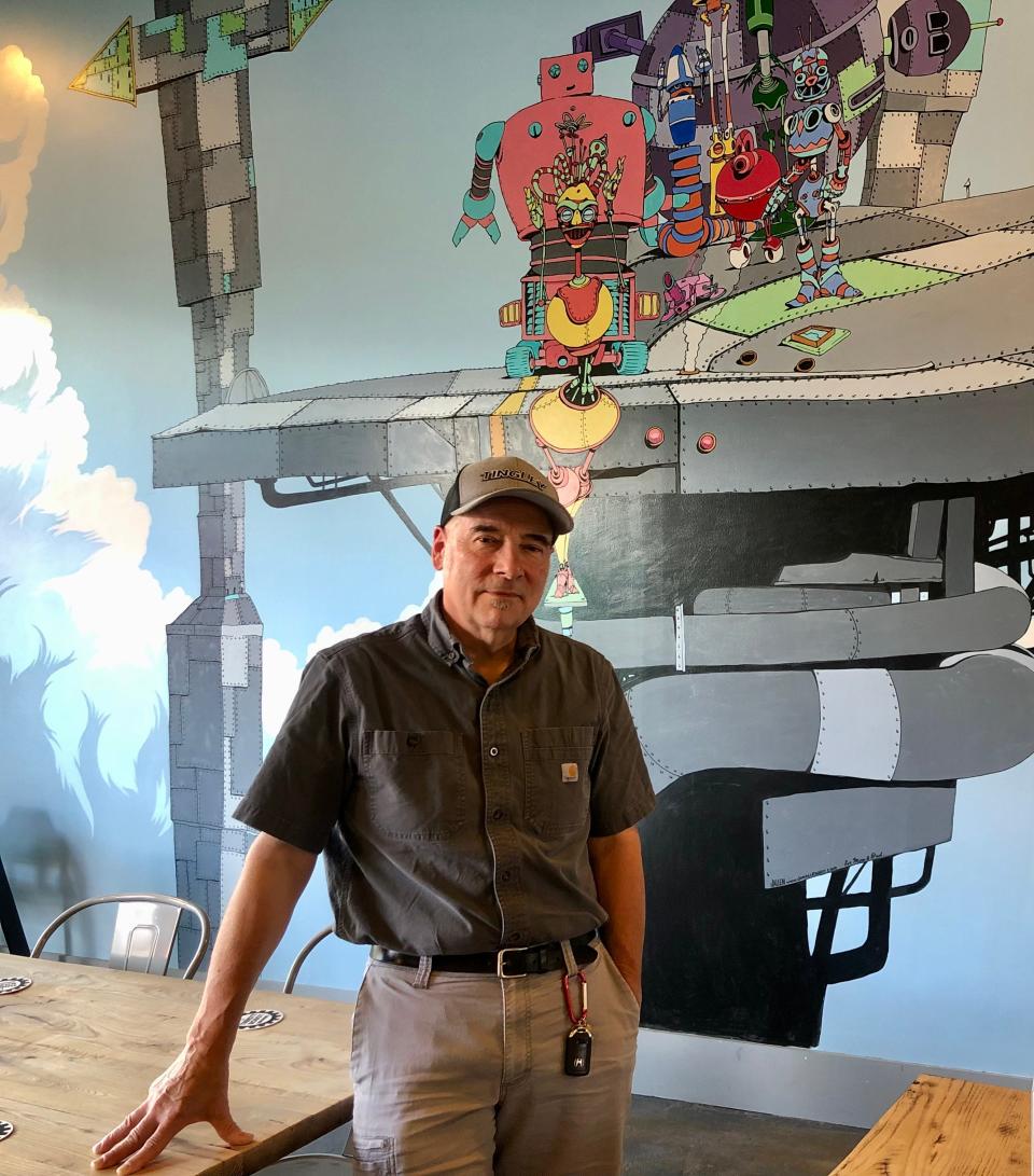 Co-founder and head brewer Bill diMario spent over 30 years as an engineer before opening Thirsty Robot. Images of robots aboud inside his garage taproom.