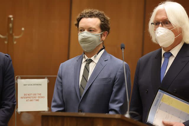 <p>LUCY NICHOLSON/POOL/AFP via Getty</p> Danny Masterson appears in court for his trial