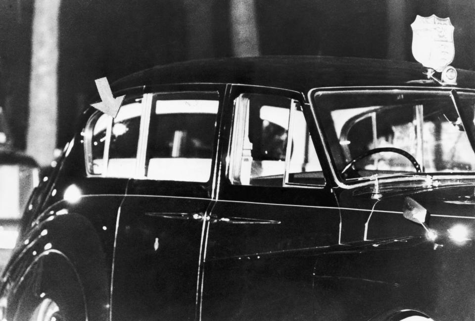 A photo of the Rolls-Royce in which Princess Anne and her husband  Mark Phillips were travelling, at the scene of an attempted kidnap on the princess in Pall Mall, London, 20th March 1974. An arrow indicates a bullet hole in one of the car's rear windows.