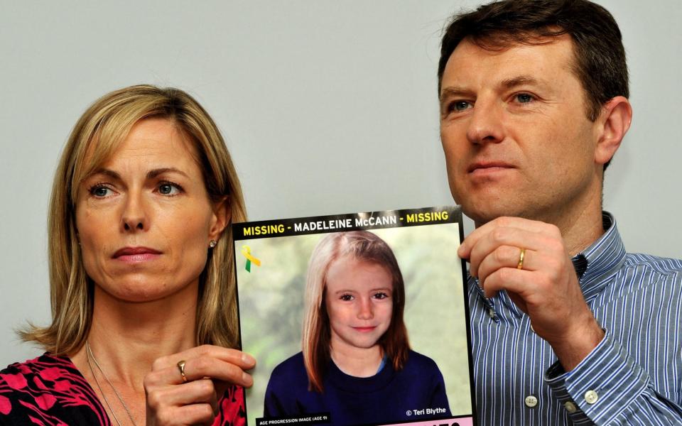 Gerry and Kate McCann hold an impression of what their daughter may look like now - Credit: PA