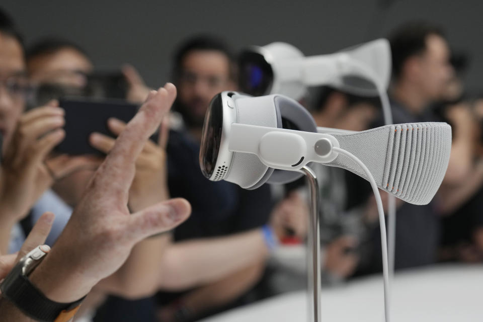 The Apple Vision Pro headset is displayed in a showroom on the Apple campus in Cupertino, Calif., at the company's annual developers conference, Monday, June 5, 2023. (AP Photo/Jeff Chiu)