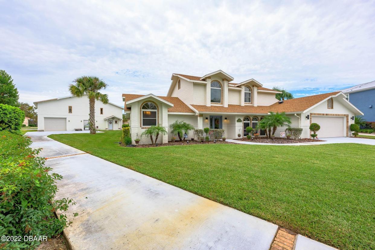 The new owners of this expansive estate on over a half an acre in Port Orange’s Spruce Creek Fly-In Community will be able to land their plane right at home and park it in a hangar in the backyard.