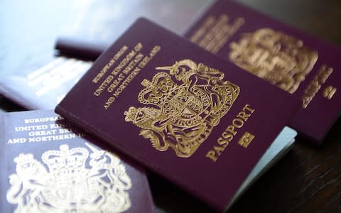 A pile of UK passports - Credit: Andy Rain/EPA