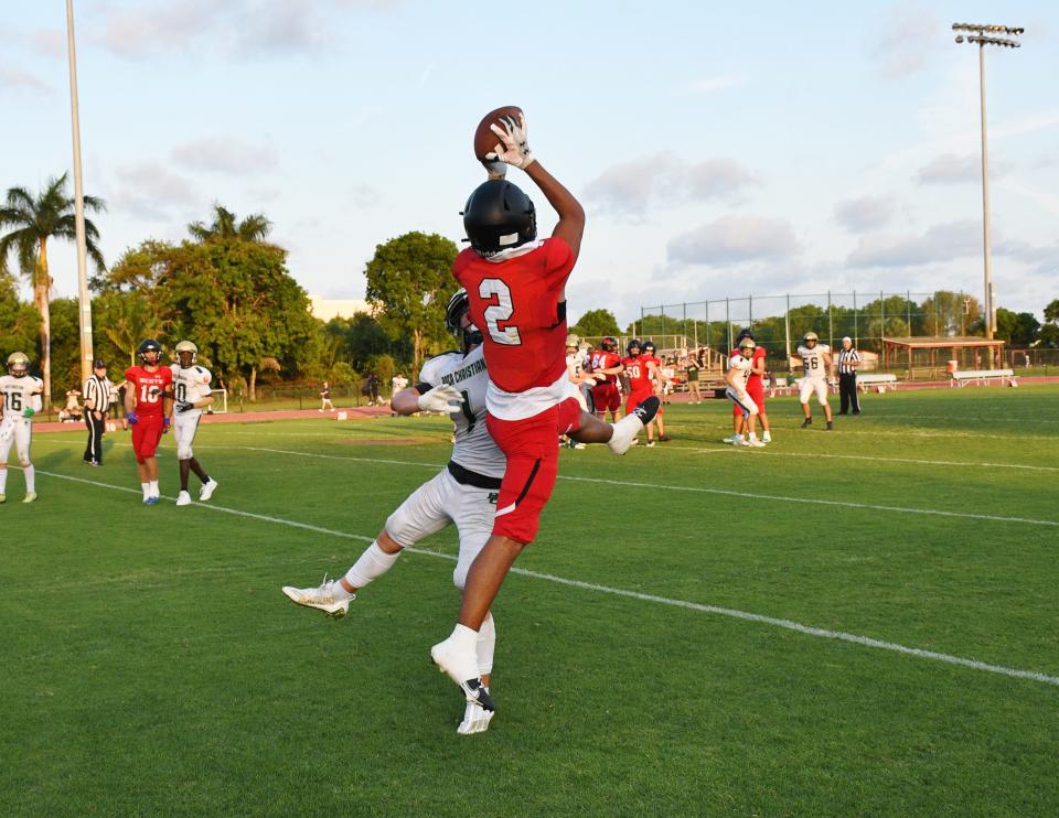 St. Andrew's star receiver Teddy Hoffman rises to catch a pass against Boca Raton Christian in spring football competition on May 11 in Boca Raton.