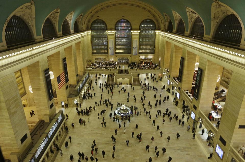 Travelers cross the main concourse of Grand Central Terminal in New York, Wednesday, Jan. 9, 2013, as seen from a bird's eye view through a window near the ceiling. The country's most famous trains station and one of the finest examples of Beaux Arts architecture in America turns 100 Feb. 1. Its centennial comes 15 years after a triumphant renovation that removed decades of grime and decay. (AP Photo/Kathy Willens)