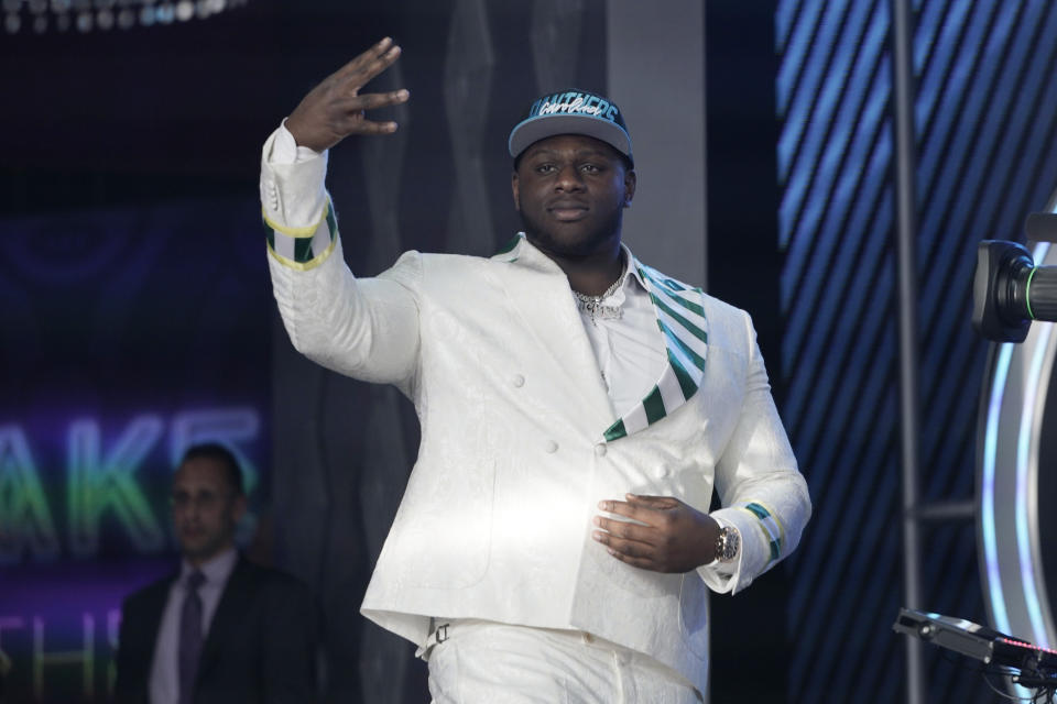 North Carolina State offensive tackle Ikem Edwonu walks to the stage after being picked by the Carolina Panthers with the sixth pick of the NFL football draft Thursday, April 28, 2022, in Las Vegas. (AP Photo/John Locher)