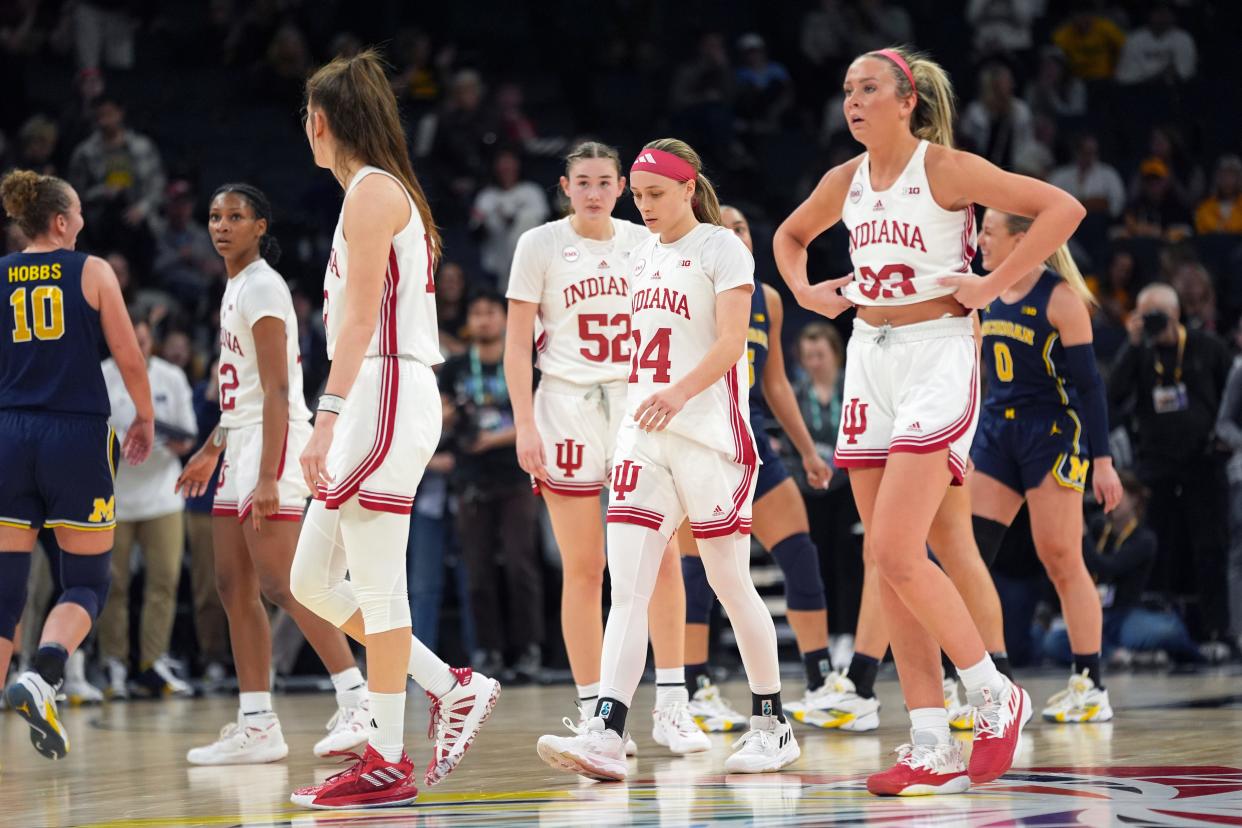 Indiana players walk off the court during the final seconds of the team's loss to Michigan of an NCAA college basketball quarterfinal game at the Big Ten women's tournament Friday, March 8, 2024, in Minneapolis. (AP Photo/Abbie Parr)