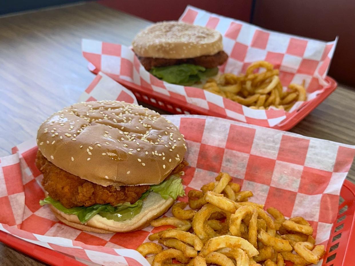 Chicken sandwiches are served with curly fries at The Chicken Stop restaurant.