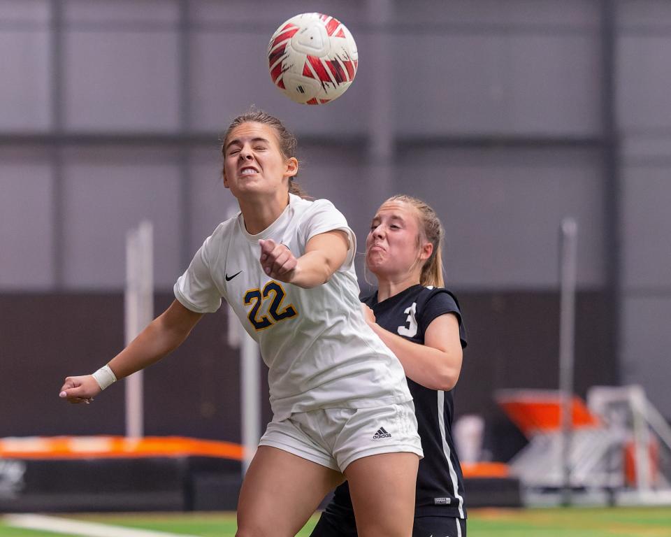 Hartland's Bella Hammond (22) and Brighton's Cameron Eberly (3) fight for the ball on Tuesday, May 7, 2024.