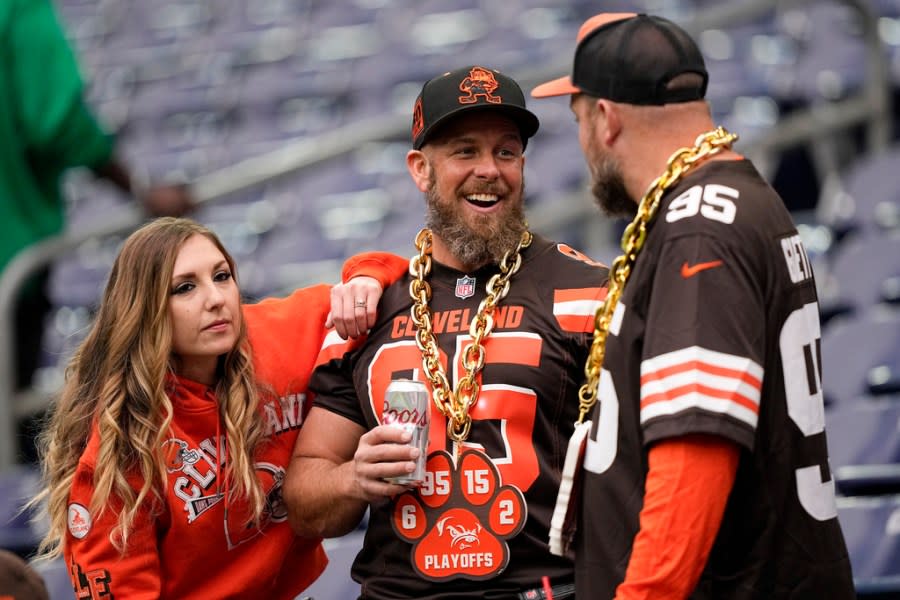Cleveland Browns fans watch during warm ups before an NFL wild-card playoff football game between the Houston Texans and the Cleveland Browns Saturday, Jan. 13, 2024, in Houston. (AP Photo/David J. Phillip)