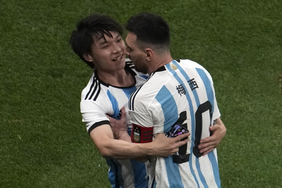 A Chinese fan runs onto the pitch to hug Soccer superstar Lionel Messi during a friendly soccer match against Australia at the Worker's Stadium in Beijing, Thursday, June 15, 2023. (AP Photo/Ng Han Guan)