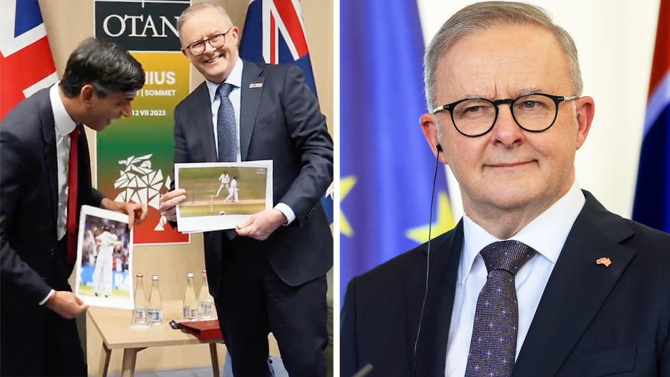 Australian prime minister Anthony Albanese showing a photo to UK PM Rishi Sunak and Albanese smiling.