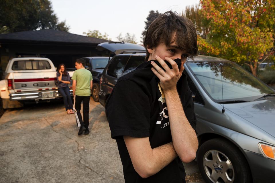 <p>Mason Heyman, 18, and his family defied a mandatory evacuation order issued on Wednesday, Oct. 11, 2017 in Calistoga, Calif. The nearby Tubbs Fire has destroyed hundreds of homes. (Photo: Paul Kitagaki Jr/Sacramento Bee via ZUMA Wire) </p>