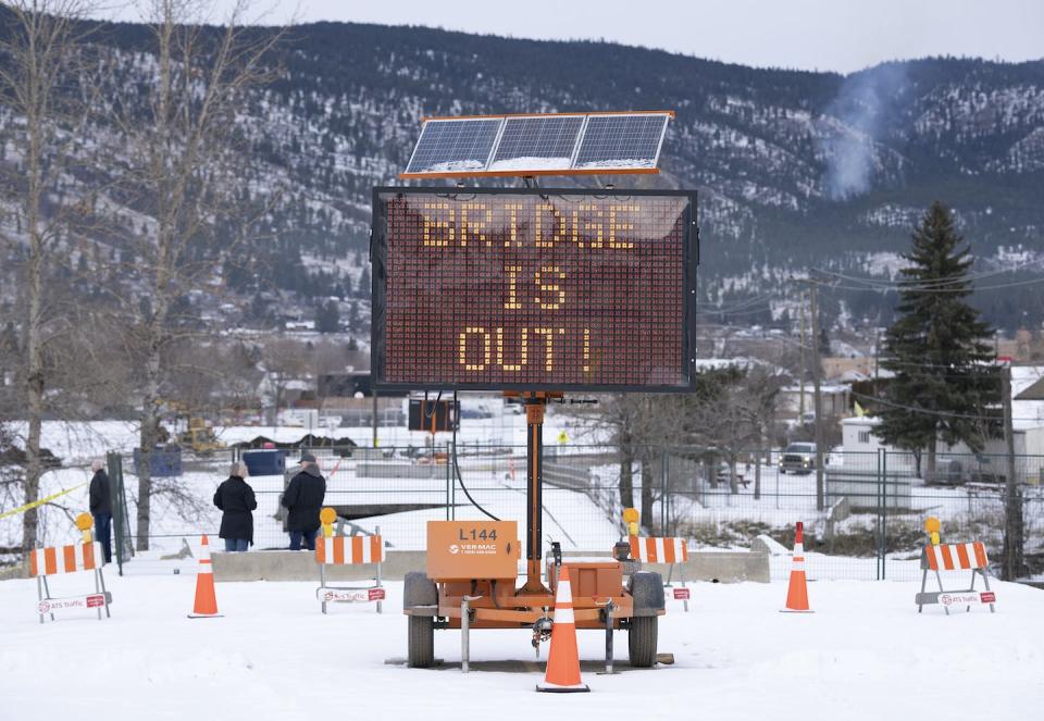 A ‘Bridge is out’ sign is seen following flood damage in Merritt, B.C. in December 2021. Extreme weather events like floods and wildfires are placing greater pressure on public infrastructure. THE CANADIAN PRESS/Jonathan Hayward