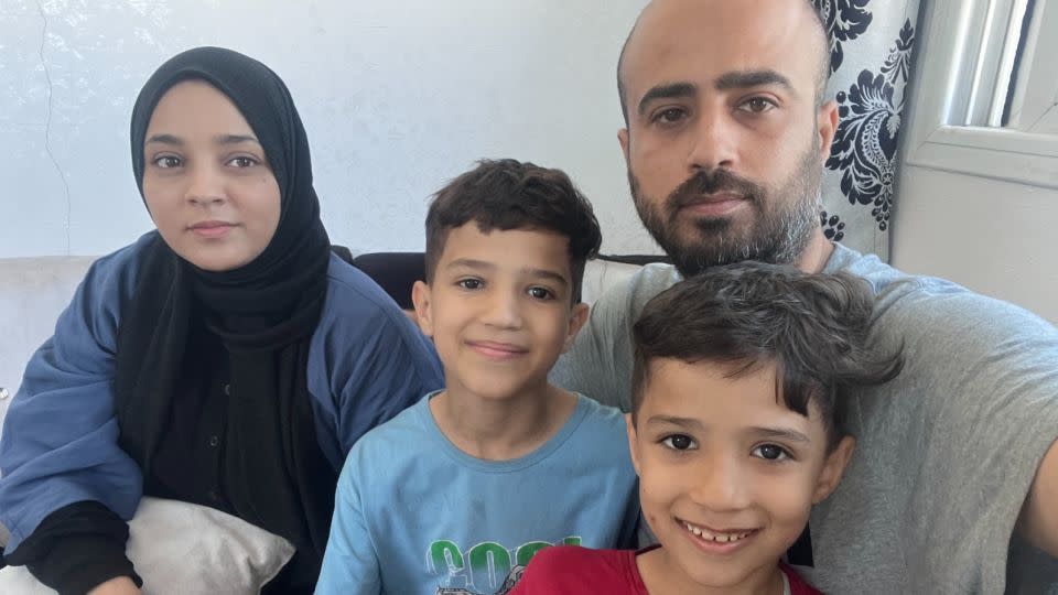 CNN producer Ibrahim Dahman is pictured with his wife, Rasha, and two children, Zeid and Khalil, in Khan Younis, Gaza on October 15. - Ibrahim Dahman/CNN