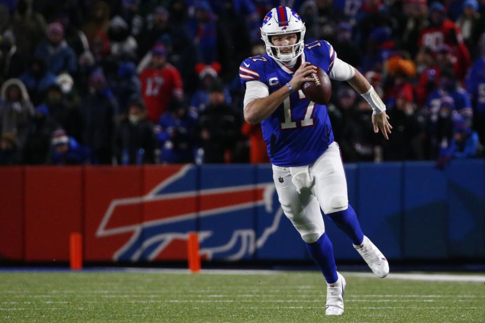 Buffalo Bills quarterback Josh Allen runs out of the pocket.